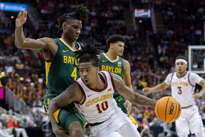 Mar 15, 2024; Kansas City, MO, USA; Iowa State Cyclones guard Keshon Gilbert (10) drives to the basket around Baylor Bears guard Ja'Kobe Walter (4) during the first half at T-Mobile Center. 